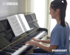 Yamaha b1 pe schwarz Frau spielt